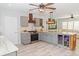 Kitchen featuring gray cabinets, stainless steel appliances, and an island with seating at 8347 41St N Ave, St Petersburg, FL 33709