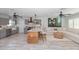 Open concept living room and kitchen with modern decor and ample seating at 8347 41St N Ave, St Petersburg, FL 33709