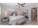 Bright main bedroom boasts a serene atmosphere with a queen-sized bed, mirrored closet doors, and stylish decor at 8347 41St N Ave, St Petersburg, FL 33709