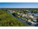 Waterfront home featuring a private dock and landscaped backyard at 9301 Sun Isle Ne Dr, St Petersburg, FL 33702