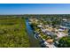 Beautiful waterfront property with lush landscaping, dock and boat lift at 9301 Sun Isle Ne Dr, St Petersburg, FL 33702