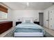Cozy bedroom with a comfortable bed, stylish decor, and ample natural light creating a relaxing retreat at 9301 Sun Isle Ne Dr, St Petersburg, FL 33702
