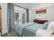 Bright bedroom with a ceiling fan and a window, offering a tranquil retreat at 9301 Sun Isle Ne Dr, St Petersburg, FL 33702