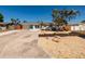 Charming home with well-manicured yard, featuring decorative rock and tasteful landscaping at 9301 Sun Isle Ne Dr, St Petersburg, FL 33702