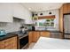 Modern kitchen with stainless steel appliances and a beautiful backsplash at 9301 Sun Isle Ne Dr, St Petersburg, FL 33702