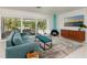 Bright and airy living room with floor-to-ceiling windows and modern decor at 9301 Sun Isle Ne Dr, St Petersburg, FL 33702