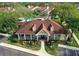 Aerial view of the community center showcasing the building's architectural design and the pool area at 9481 Highland Oak Dr # 1003, Tampa, FL 33647