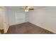 A well-lit room with a ceiling fan, a window with blinds, and beautiful dark-toned tile flooring at 9481 Highland Oak Dr # 1003, Tampa, FL 33647