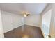 A well-lit room with a ceiling fan, a window with blinds, and beautiful dark-toned tile flooring at 9481 Highland Oak Dr # 1003, Tampa, FL 33647