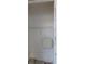 Interior view of a closet showcasing shelving, clean white walls, and a small power box at 9481 Highland Oak Dr # 1003, Tampa, FL 33647