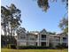 Inviting two-story condo with a screened in porch and mature trees at 9481 Highland Oak Dr # 1003, Tampa, FL 33647