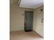 Entryway to unit 1003 featuring a neutral painted door, side walls, and black welcome mat at 9481 Highland Oak Dr # 1003, Tampa, FL 33647