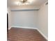 Cozy dining area with wood-look flooring, neutral paint, and updated light fixture at 9481 Highland Oak Dr # 1003, Tampa, FL 33647