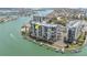 Luxury waterfront condo building with boat docks and resort-style amenities at 9495 Blind Pass Rd # 907, St Pete Beach, FL 33706