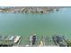 Breathtaking aerial view showcases the waterfront community and docks with stunning aquamarine water at 9495 Blind Pass Rd # 907, St Pete Beach, FL 33706