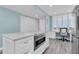 Bright kitchen features stainless appliances, island, and built-in desk area at 9495 Blind Pass Rd # 907, St Pete Beach, FL 33706