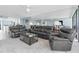 Open concept living room with kitchen and dining area at 9495 Blind Pass Rd # 907, St Pete Beach, FL 33706