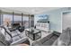 Relaxing living area with a view and comfortable couches at 9495 Blind Pass Rd # 907, St Pete Beach, FL 33706