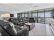 Comfortable living room with plush seating and view to the balcony at 9495 Blind Pass Rd # 907, St Pete Beach, FL 33706