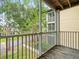 Enjoy the outdoors from this balcony with views of the community and lush landscaping at 10028 Strafford Oak Ct # 712, Tampa, FL 33624
