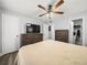 Bedroom with ceiling fan, TV, and walk-in closet at 10028 Strafford Oak Ct # 712, Tampa, FL 33624