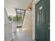 Condo front door, with stairs and entry area, providing access to the residence at 10028 Strafford Oak Ct # 712, Tampa, FL 33624