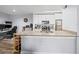 Well-lit kitchen with granite counters, flowing into a combined living and office space at 10028 Strafford Oak Ct # 712, Tampa, FL 33624