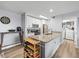 Bright kitchen with granite counters, white cabinets and stainless steel appliances plus a laundry room at 10028 Strafford Oak Ct # 712, Tampa, FL 33624