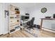 A spacious living area with work space, dartboard, and hardwood floors at 10028 Strafford Oak Ct # 712, Tampa, FL 33624