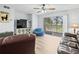Inviting living room with sliding glass doors to a balcony and comfortable seating at 10028 Strafford Oak Ct # 712, Tampa, FL 33624