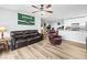 Comfortable living room with modern flooring, decor, and an open layout connected to the kitchen at 10028 Strafford Oak Ct # 712, Tampa, FL 33624