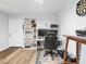 View of a spacious living area with hardwood floors and a door leading to the outside at 10028 Strafford Oak Ct # 712, Tampa, FL 33624
