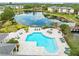 Relaxing community pool and lake provide a peaceful retreat surrounded by mature trees and landscaping at 10028 Strafford Oak Ct # 712, Tampa, FL 33624