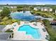 Community pool and lake provide a relaxing outdoor space with ample seating and lush landscaping at 10028 Strafford Oak Ct # 712, Tampa, FL 33624