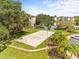 Outdoor sand volleyball court, surrounded by well-maintained landscaping and mature trees, ideal for community recreation at 10028 Strafford Oak Ct # 712, Tampa, FL 33624