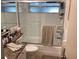 Cozy bathroom features a shower-tub combination with glass doors and modern fixtures at 101 Madonna Blvd, St Petersburg, FL 33715