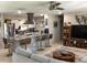 Open-concept kitchen and living area with stainless steel appliances, a kitchen island, and cozy seating at 101 Madonna Blvd, St Petersburg, FL 33715