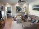 Comfortable living room with a neutral-toned sofa, side table, and a view into the adjacent kitchen at 101 Madonna Blvd, St Petersburg, FL 33715