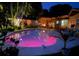 Inviting backyard pool and patio with stylish outdoor furniture and lush landscaping create a private oasis at 101 Madonna Blvd, St Petersburg, FL 33715