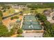 Aerial view of a community with tennis courts, shuffleboard, and a golf course at 1046 Almondwood Dr, Trinity, FL 34655