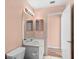 The bathroom has a sink with a vanity and a mirror with lights at 1046 Almondwood Dr, Trinity, FL 34655