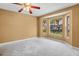 Spacious bedroom with a bay window letting in natural light and view of the outside at 1046 Almondwood Dr, Trinity, FL 34655