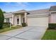 Exterior shot showing the garage and front entrance of the house at 1046 Almondwood Dr, Trinity, FL 34655
