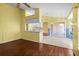 Open-concept area with hardwood and tile floors. This space includes a dining area and a kitchen at 1046 Almondwood Dr, Trinity, FL 34655