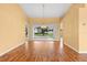 Bright room featuring wood flooring and a sliding glass door leading to the outdoors at 1046 Almondwood Dr, Trinity, FL 34655