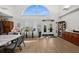 Well-lit meeting room featuring a large arched window and ample seating at 1046 Almondwood Dr, Trinity, FL 34655