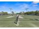 View of the community tennis courts with lighting for evening play at 1046 Almondwood Dr, Trinity, FL 34655