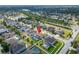 Aerial view of the property in its neighborhood context, with a nearby lake and convenient community amenities at 11804 Harpswell Dr, Riverview, FL 33579