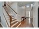 The front foyer features hardwood floors and an open staircase at 11804 Harpswell Dr, Riverview, FL 33579