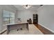 Bright home office features a ceiling fan, hardwood floors, and neutral decor at 11804 Harpswell Dr, Riverview, FL 33579